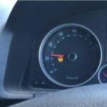 what causes the power steering warning light to come on